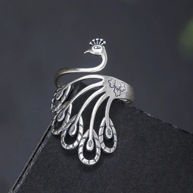 Vintage Silver Phoenix Feather Adjustable Ring
 
 Make a statement with this S925 Silver Vintage Peacock Feather Ring. Crafted with precision and featuring an intricate phoenix design, this ring is a must-have fRingThebesttailorThebesttailors925 silver vintage peacock ring peacock feather ringThebesttailors925 silver vintage peacock ring peacock feather ring