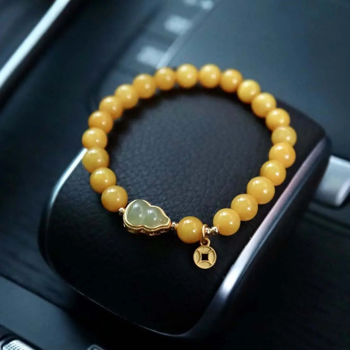 Elegant Natural Beeswax and Hetian Jade Bracelet with 925 Silver Gold-
 Exude Elegance with Natural Beeswax and Hetian Jade Bracelet
 Enhance your style with our exquisite natural beeswax bracelet adorned with Hetian jade and 925 silveWomen's BraceletThebesttailorThebesttailorNatural Beeswax Beaded 5mm/7mm BraceletThebesttailorNatural Beeswax Beaded 5mm/7mm Bracelet