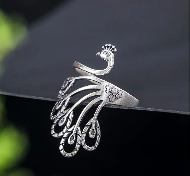 Vintage Silver Phoenix Feather Adjustable Ring
 
 Make a statement with this S925 Silver Vintage Peacock Feather Ring. Crafted with precision and featuring an intricate phoenix design, this ring is a must-have fRingThebesttailorThebesttailors925 silver vintage peacock ring peacock feather ringThebesttailors925 silver vintage peacock ring peacock feather ring